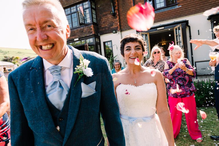 Couple enjoy confetti at their Tottington Manor wedding