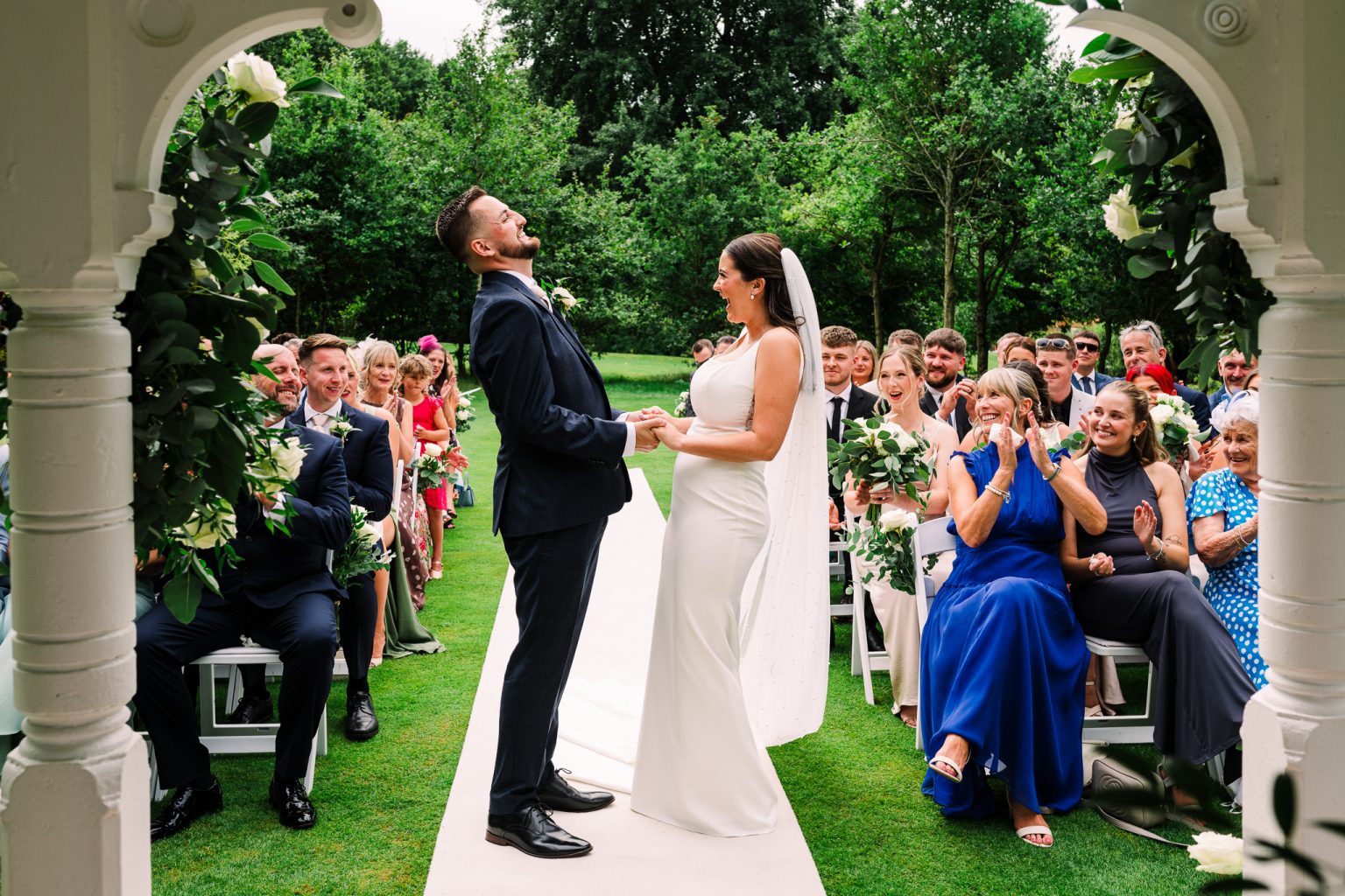 Outdoor wedding ceremony at The Cottesmore, West Sussex