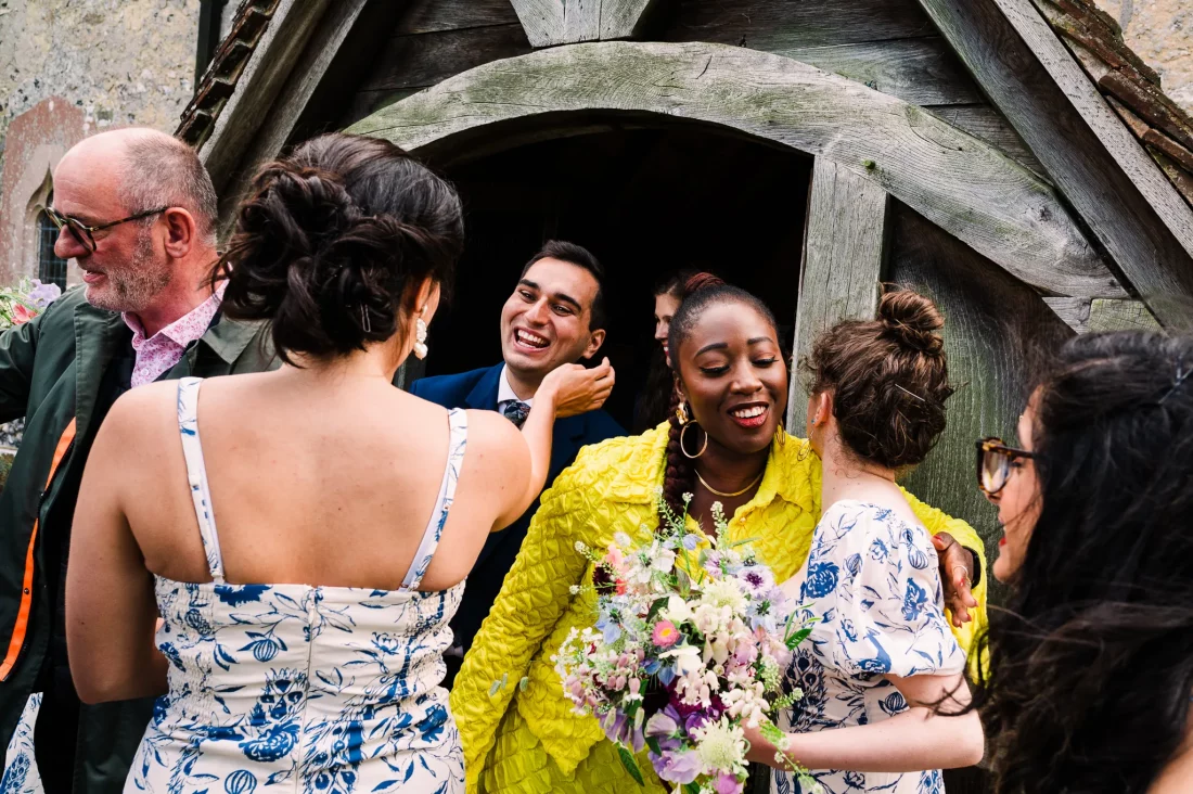Guests greeting at Sussex church wedding